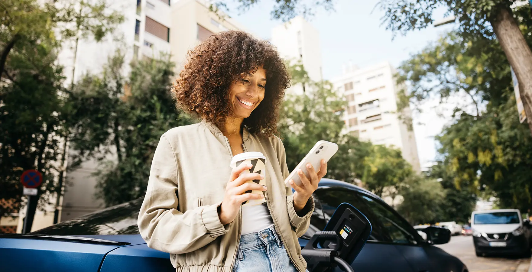 Woman leaning on car