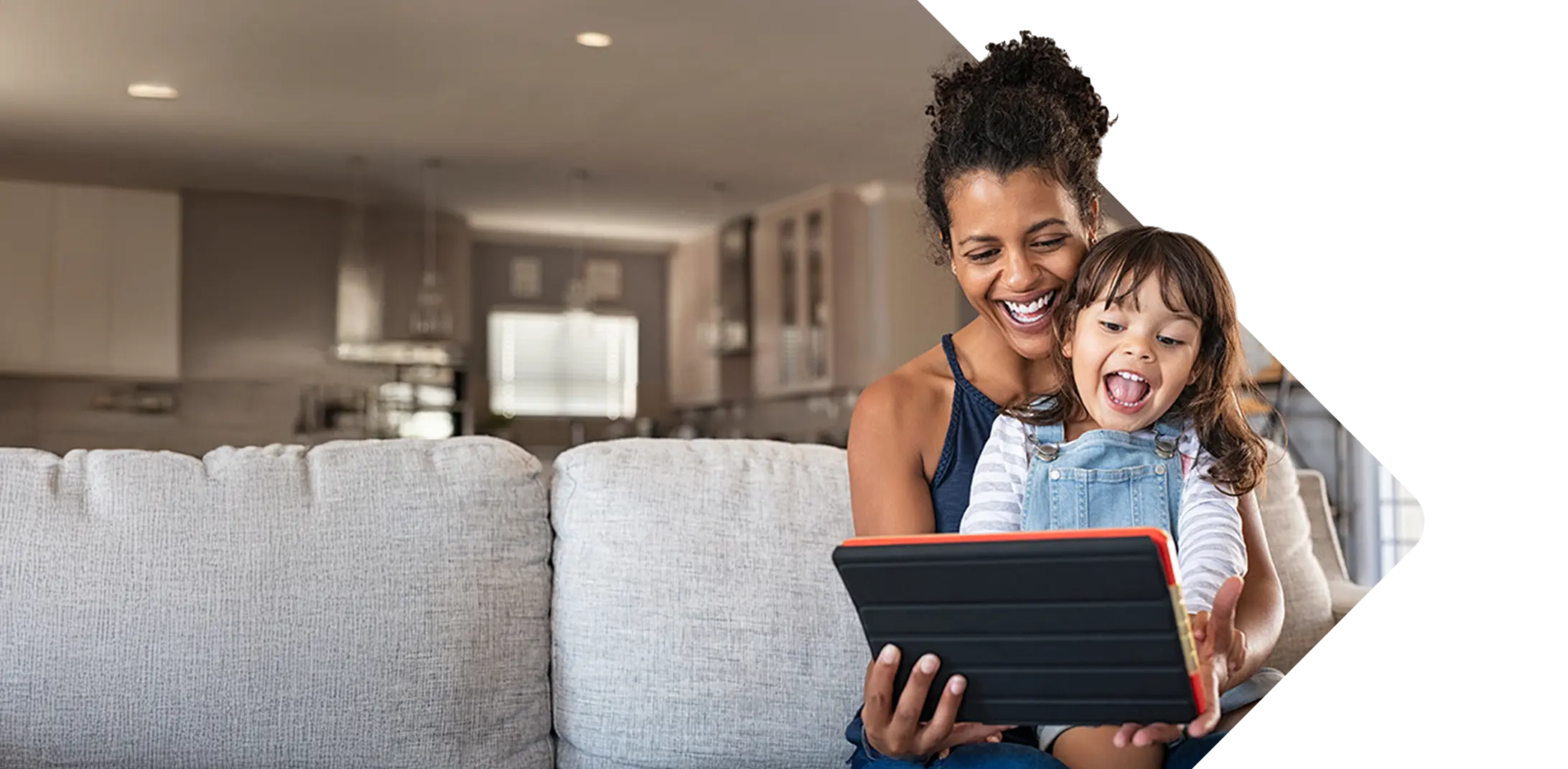 Woman and child looking at a mobile device
