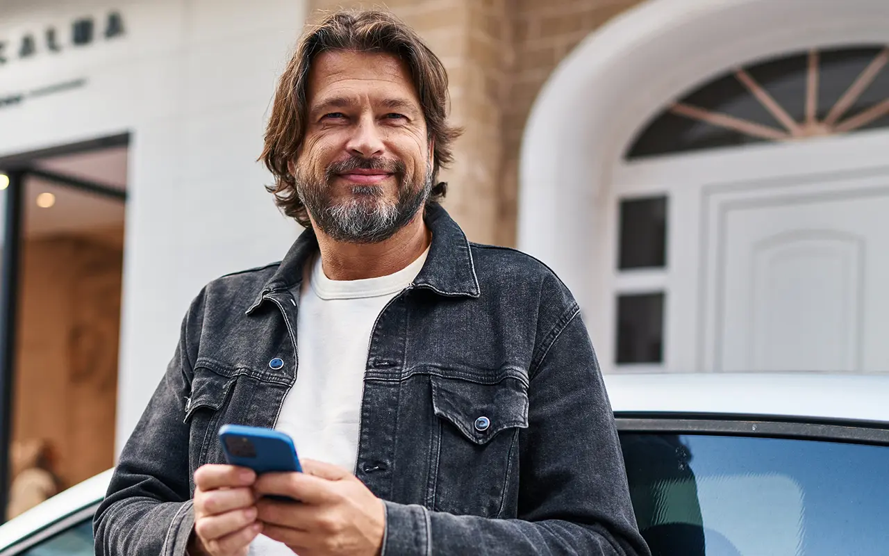 Man leaning on car