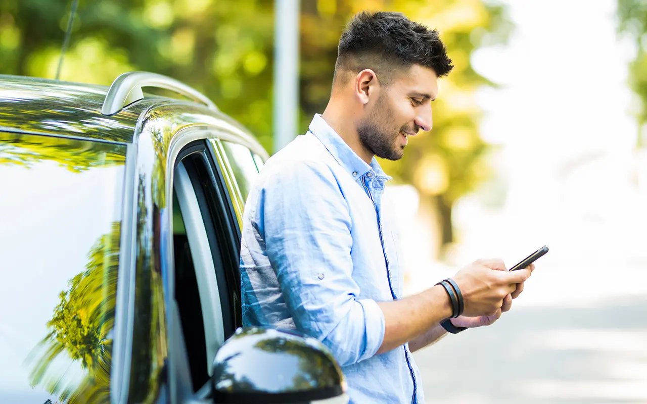 Man leaning on car