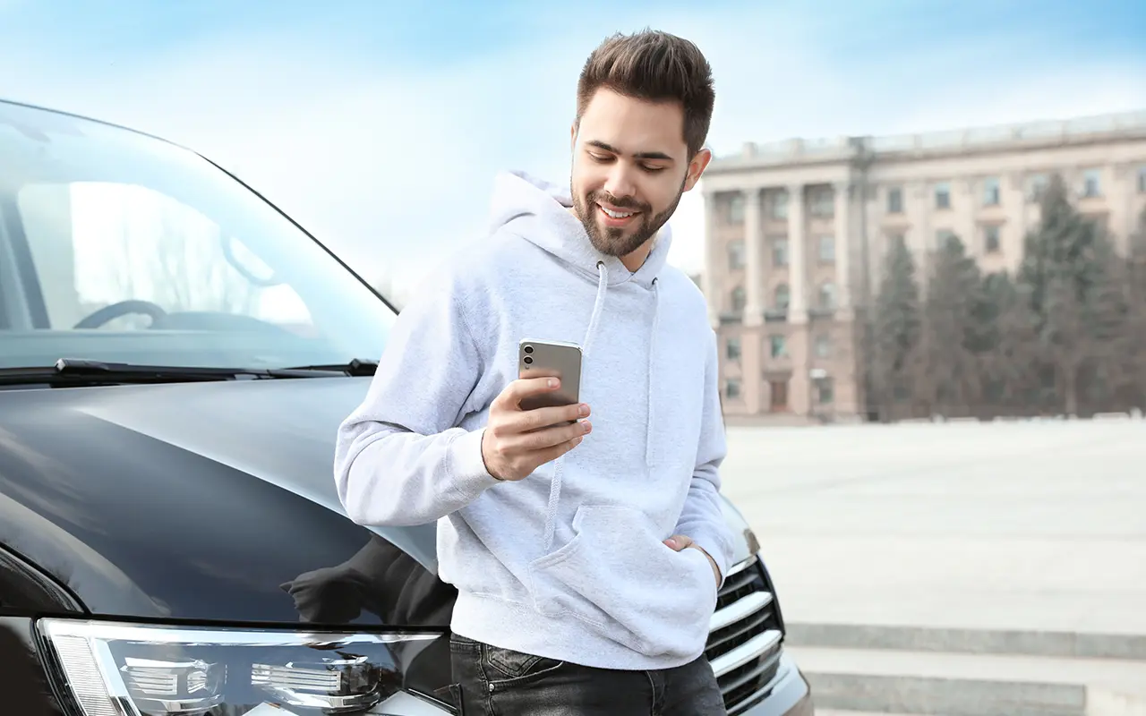 Man leaning on car