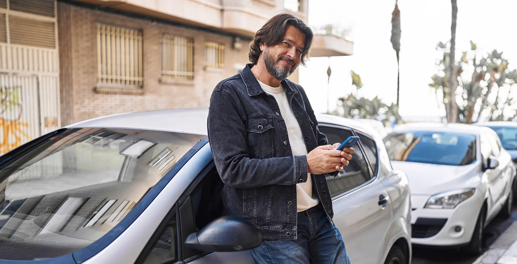 Man leaning on car