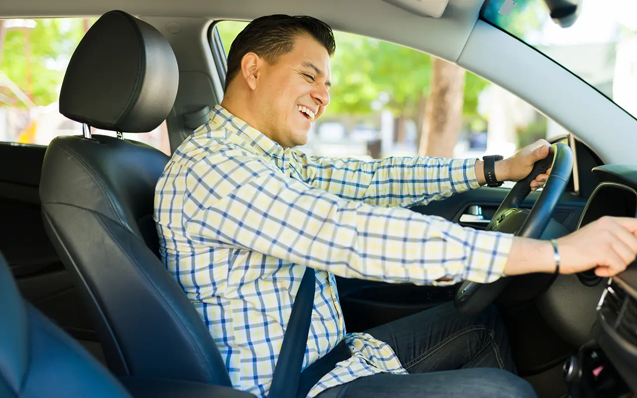 Man controlling radio in car